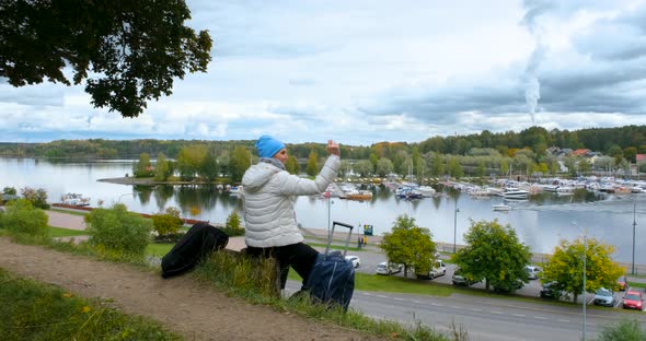 Young Woman Takes Pictures on the Phone in Finland