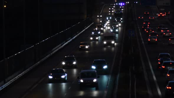 Cars Crowd in a Highway at Night