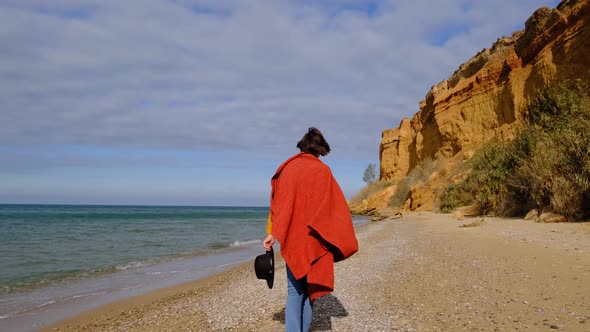 Young Woman Enjoy View of the Sea Breathe Deeply and Smile