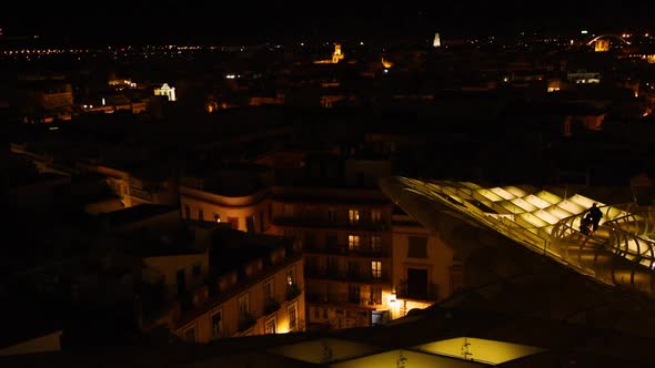 Magical nighttime illumination on the Setas de Sevilla. Aurora Experience and the skyline of Sevilla