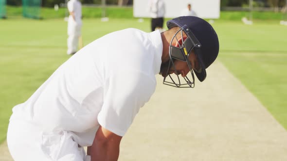 Cricket player standing and looking at the camera