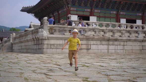 Little Boy Visit Ancient Palace in Seoul, South Korea. Travel To Korea Concept. Slowmotion Shot