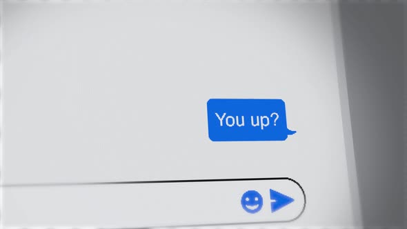 You up - text message close up on screen of chat on phone or computer