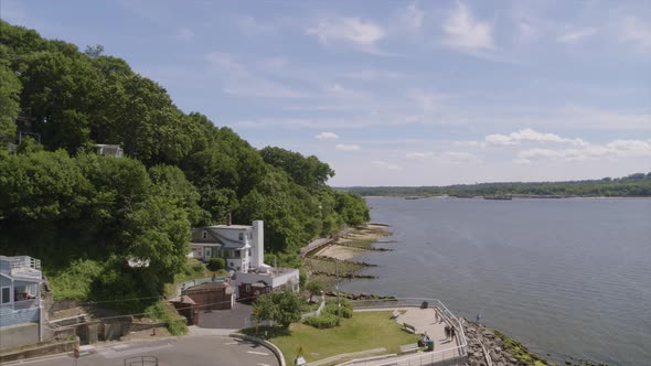 Aerial Pan Around of a Small Town by a Lake