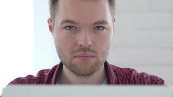 No Young Man Rejecting By Shaking Head at Work