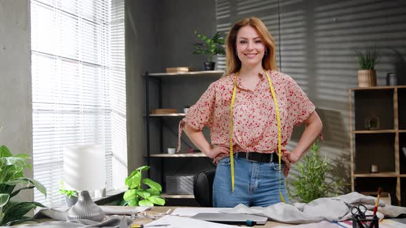 Portrait of Attractive Happy Female Creative Clothing Designer Standing in Modern Office