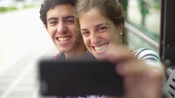 Couple taking selfie and making funny faces