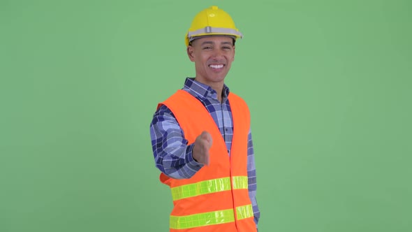 Happy Multi Ethnic Man Construction Worker Giving Handshake