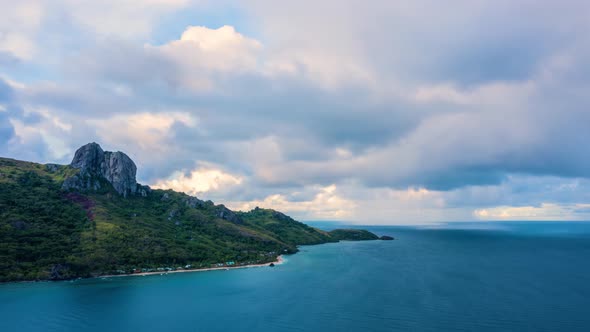 Timelapse of rain clouds approaching a paradise island in the Pacific Ocean, 4K