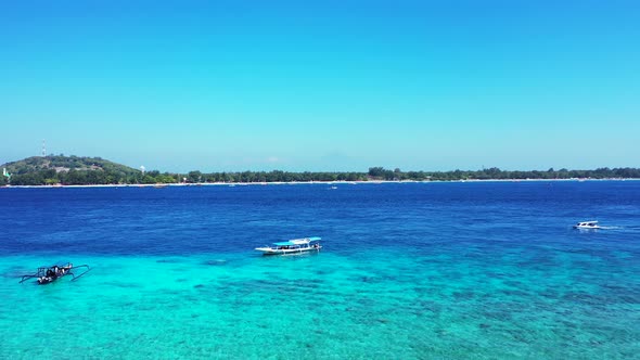 Wide above tourism shot of a white sandy paradise beach and aqua turquoise water background in hi re