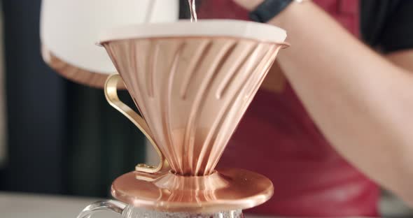 Process of V60 Barista at Work Make a Cup of Strong Coffee Into a Paper Filter