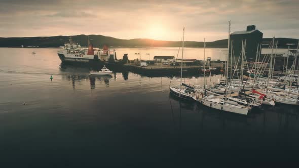 Aerial Sunrise Over Motor Boat Sailing at Ferry Terminal