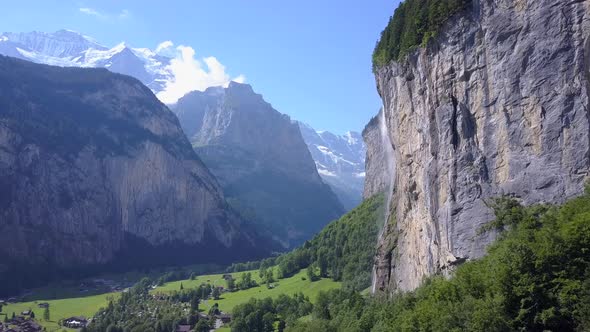 Aerial travel drone view of the Lauterbrunnen Valley and Staubbach Falls, Switzerland.