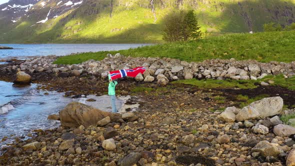 Woman with a Waving Flag of Norway