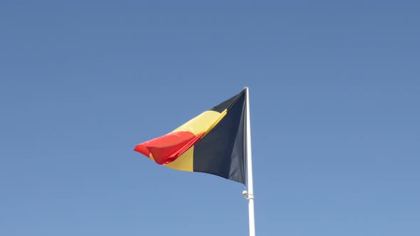 On wind fabric of   Belgian  national symbol 4K 2160p 30fps UltraHD footage - Flag of  Belgium trico