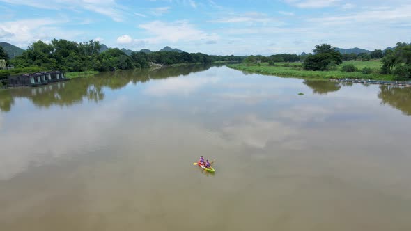 Couple Men and Women in Kayak on the River Kwai in Thailand