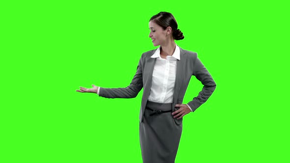 Businesswoman gesturing against green screen