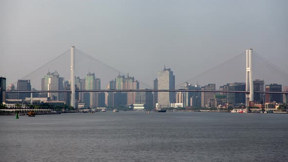 Shanghai Nanpu Bridge Over Huangpu Against City Timelapse