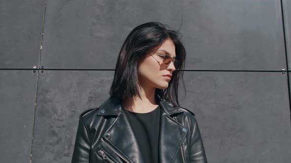 Portrait Confident Young Brunette Female in Trendy Stylish Look Wearing Black Leather Jacket and