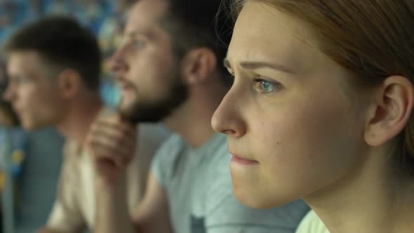 Girl Fan With Friends Watching Sport Game or Races at Stadium, Worried, Anxious