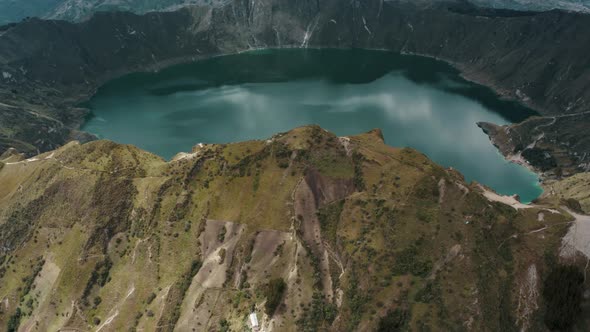 Ecuadorian Andes Volcano And Blue Lagoon Of Quilotoa In Ecuador. Aerial Tilt-up Shot