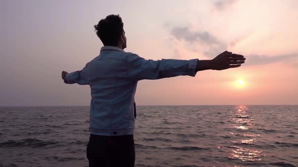 Man Raised Hands At The Beach