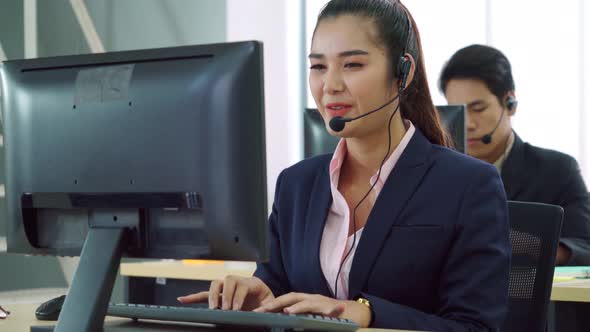 Business People Wearing Headset Working in Office