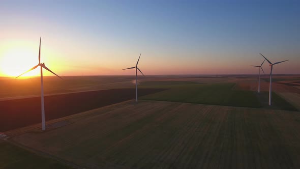 Wind Turbines in field at Sunset