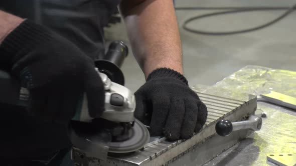 A Man Cleans the Detail From Burr Grinder