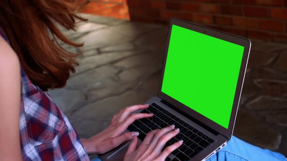 Schoolgirl using laptop