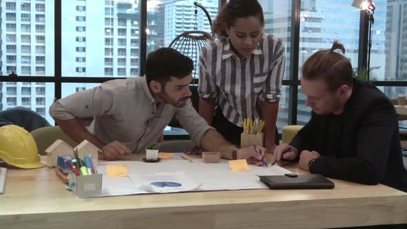 Creative Business People Group Having Conversation at Office Desk in Workplace