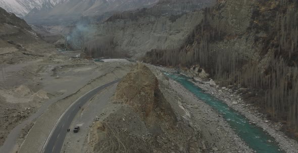 Aerial View Of Karakoram Highway Road Beside River At Hunza Valley. Dolly Right