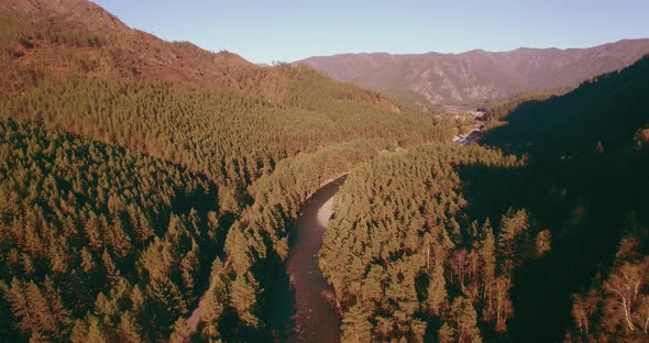 Low Altitude Flight Over Fresh Fast Mountain River with Rocks at Sunny Summer Morning.