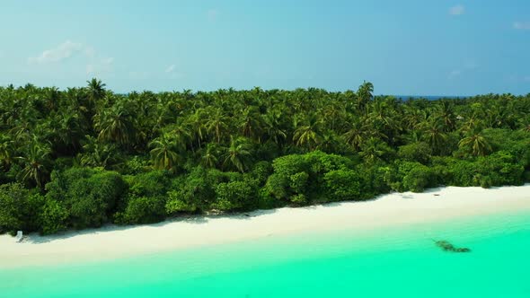 Aerial drone view scenery of beautiful shore beach journey by blue lagoon and white sandy background