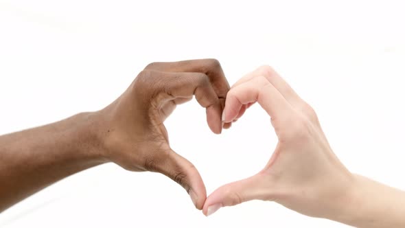 Heart From Hands Close Up Multiracial Couple African Man and Caucasian Woman Lovers Concept Mixed