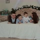 Happy Young Family Lying on the Bed. - VideoHive Item for Sale