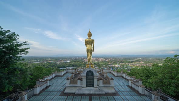 Time lapse of golden buddha pagoda stupa. Wat Phrathat Khao Noi Temple Park, Nan, Thailand