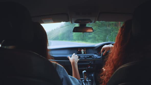 Two Happy Female Woman Friends Enjoy Travel in Car