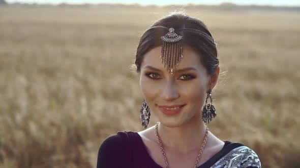 Ethnicity, Asian Culture Lifestyle. An Elegant Indian Woman in Ethnic Oriental Sari Dress Closeup