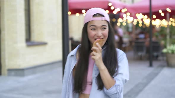 Asian woman eating ice cream.