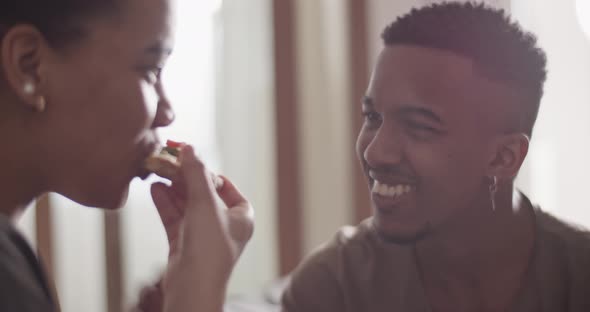 Multiracial Couple Sharing Pizza Together