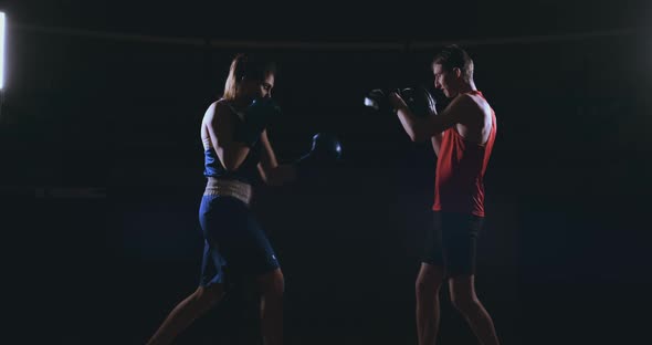 Fitness Woman Athlete Boxing Punching Focus Mitts Enjoying Intense Exercise Female Fighter Training