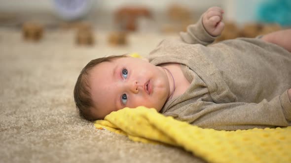 Adorable Little Baby Lying, Birth Statistics and Governmental Children Aid