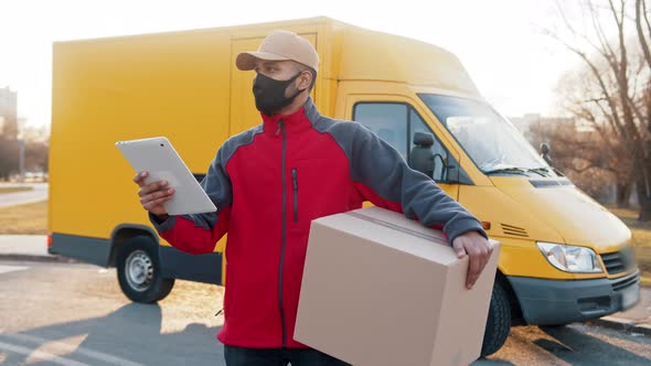 Courier Delivering Parcels During Covid19 Man Wearing Mask While Carrying Boxes