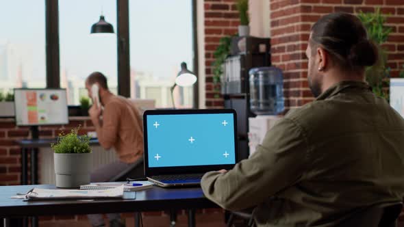 Company Employee Working on Laptop with Greenscreen