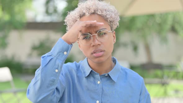 Portrait of Young African Woman Looking Around Searching