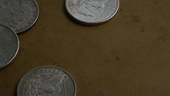 Rotating stock footage shot of antique American coins - MONEY 0062