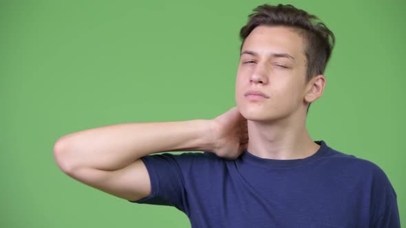 Young Handsome Teenage Boy Having Neck Pain