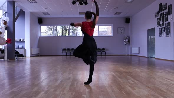 Slow motion female dancer spinning