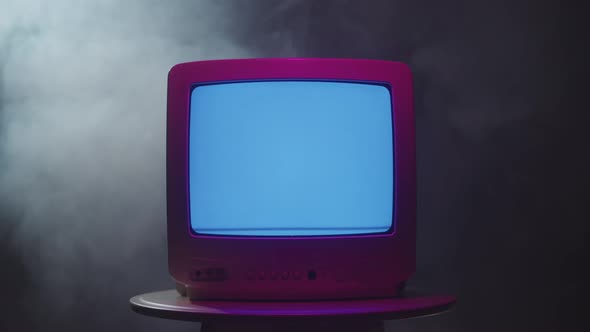 Old Vintage Television on Black Background with Smoke